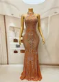Detailed view of luxury orange rhinestone floor-length evening gown with halter neck - S / Tops / Orange Red