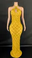 Detail view of golden halter mermaid gown with intricate crystal lattice design - Gold