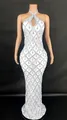 Detailed view of white halter gown with teardrop crystal diamond patterns. - White