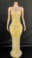 Detailed view of yellow halter neck pageant dress with silver sequins and teardrop diamonds - Yellow