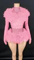 Detailed view of pink rhinestone bodysuit with ruffled tulle shoulders and waist. - S / Top And Bottom / Pink