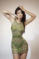 Close-up of a glamorous green rhinestone mesh mini dress on a model for performance wear - S / Top And Bottom / Yellow-Green