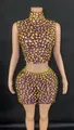 Glamorous purple sleeveless mock neck crop top and mini skirt set with gold rhinestones - Purple Base with Gold Rhinestones