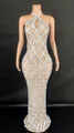 Elegant halter neck pageant gown decorated with silver teardrop crystals and mesh detailing - Apricot