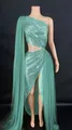 Close-up detail of mint green sequin evening gown featuring waist cutout and leg slit - S / Top And Bottom / Emerald Green