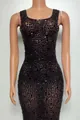 Detailed view of a sleeveless bodycon mini dress with black rhinestone embellishments - Black