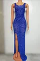 Luxurious royal blue sequined evening dress with sexy side split detail on mannequin - Sapphire Blue