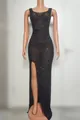 Front view of an elegant black evening dress with rhinestones and a daring high leg slit. - Black