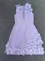Macro shot of handcrafted 3D flowers and crystal beads on a lavender bandage dress - Light Purple