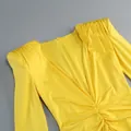Detailed view of bright yellow deep V-neck dress featuring elegant ruched shoulder details - S / Yellow