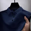 Close-up of navy blue waffle texture fabric on men's quick-dry polo shirt with collar - Navy Blue