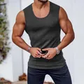 Close-up of men's slim fit ribbed gym tank top in dark grey with athletic cut. - M / Tops / Dark Gray