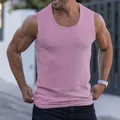 Close-up detail of a pink ribbed slim fit men's fitness tank top with wide straps - M / Tops / Pink