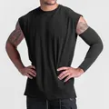 Front view of men's loose black sleeveless tank top for gym fitness and training - M / Tops / Plain Black
