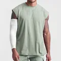 Front view detail of a men's oversized sage green sleeveless tank top for fitness training - M / Tops / Solid Light Green