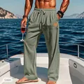 Men's green straight-leg casual pants with drawstring waist shown on a luxury yacht. - Green