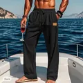 Detail showing men's black drawstring elastic waist straight-leg casual resort pants. - S / Bottoms / Black