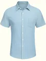 Macro view of light blue seersucker fabric and pocket on men's short-sleeve shirt - M / Tops / Light Blue
