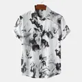 Close-up of men's short sleeve shirt featuring a black ink wash print on white - Black (C97)