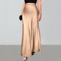 Detailed view of champagne satin maxi skirt with high waist and smooth silk-like finish - XS / Bottoms / Champagne