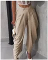 Detailed view of women's khaki high-waisted pleated tulip trousers with elegant drape - Camel