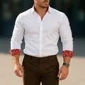 Elegant men's white long-sleeve casual shirt featuring red paisley collar and cuffs - S / Tops / White