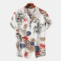 Detail view of white Hawaiian short sleeve shirt with colorful tropical leaf prints - White Tropical Floral Print (PL012)