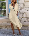 Full-length detail of a loose beige cotton linen maxi shirt dress with buttons and pockets - S / Khaki