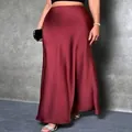 Elegant wine red satin silk midi skirt shown on model with a graceful drape for women - XS / Bottoms / Burgundy