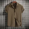 Detail of men's casual olive green short sleeve button down shirt with textured fabric - Army Green