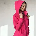 Side view detail of a vibrant pink hooded windbreaker with an adjustable drawstring waist. - S / Tops / Rose Red