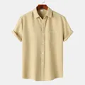 Close-up detail of yellow short sleeve waffle knit button-down casual shirt for men - Khaki