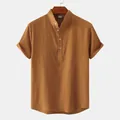 Close-up detail of men's summer cotton linen casual shirt with stand collar and buttons - Brown