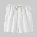 Close-up front view of white cotton linen men's casual shorts with drawstring elastic waist - S / Bottoms / White