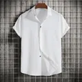 Macro detail of men's white short-sleeved button-down shirt featuring textured fabric - 3XL / Tops / White
