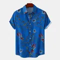 Detailed view of men's casual short-sleeve shirt with blue floral print and white cuff - 3XL / Tops / Blue