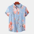 Detailed view of men's short-sleeved Hawaiian shirt in light blue with orange rose print - 3XL / Tops / Orange Pink Rose Light Blue (C54)