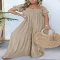 Full length detail of square neck smocked bodice and wide leg cut of the jumpsuit - S / Top And Bottom / Apricot