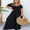 Model wearing a stylish black plus size jumpsuit with puff sleeves and wide-leg design - S / Top And Bottom / Black