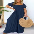 Detailed view of women's plus size navy blue puff sleeve pleated wide-leg jumpsuit - S / Top And Bottom / Navy Blue