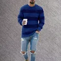 Detail view of a men's blue striped knitted sweater with a casual crewneck design - S / Tops / Blue