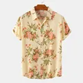 Detailed view of a men's short sleeve casual shirt featuring a vibrant floral pattern - 2XL / Tops / Khaki with Orange Pink Floral (C64)