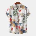 Detail of a men's tropical print beach shirt showing floral patterns and wooden hanger - M / Tops / Colorful