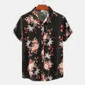 Detail of men's short-sleeved floral shirt with lapel collar and button-up front. - 2XL / Tops / Black with Red Berries White Floral (C64-Black)