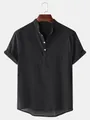 Vue de face d'une chemise décontractée pour hommes en coton et lin noir à col montant - M / Hauts / Noir