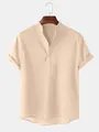 Detail showing the stand collar and button placket of a beige men's cotton linen shirt - Khaki
