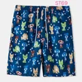 Close-up detail of navy blue men's beach shorts featuring colorful cartoon dog prints - M / Bottoms / Navy Cartoon Dog (ST68)