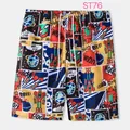 Close-up detail of men's vibrant comic print beach shorts with white drawstring waistband - XL / Bottoms / Colorful Comics Style (ST76)