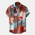 Detailed view of men's casual short-sleeve shirt with vibrant abstract oil painting print. - M / Tops / Orange