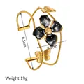 Vue détaillée du bracelet fleur noire avec un diamètre de 6,5 cm et un poids de 19 g. - Style Fleur à Quatre Feuilles Noire Papillon (JZB1078) / Or